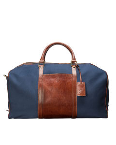 Sac de voyage haut de gamme en toile bleu marine et cuir pour homme élégant. Fabriqué à la main au cœur de l'Italie.
